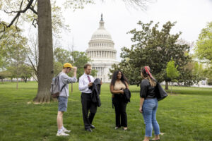 (L-R) Undergraduate students Jacob David, Logan Williamson, De’Omini Daniely and Emma Brandwein on the lawn of the U.S. Capitol.