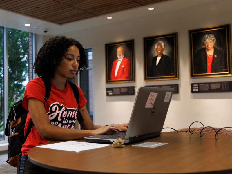 Resident assistant Jadin Marshall prepares for student check in at Black-Diallo-Miller Hall on residence hall move-in day.